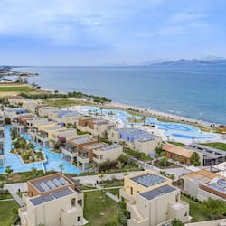 Relax by the central pools, surrounded by modern buildings and a stunning sea view.