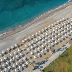 On the beach, black sand, free beach shuttle, sun-loungers