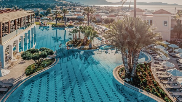 A large swimming pool with a view of the sea and mountains in the background. - Lindos Imperial Resort & Spa (Rhodes)