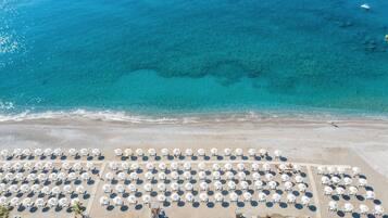 On the beach, black sand, free beach shuttle, sun-loungers
