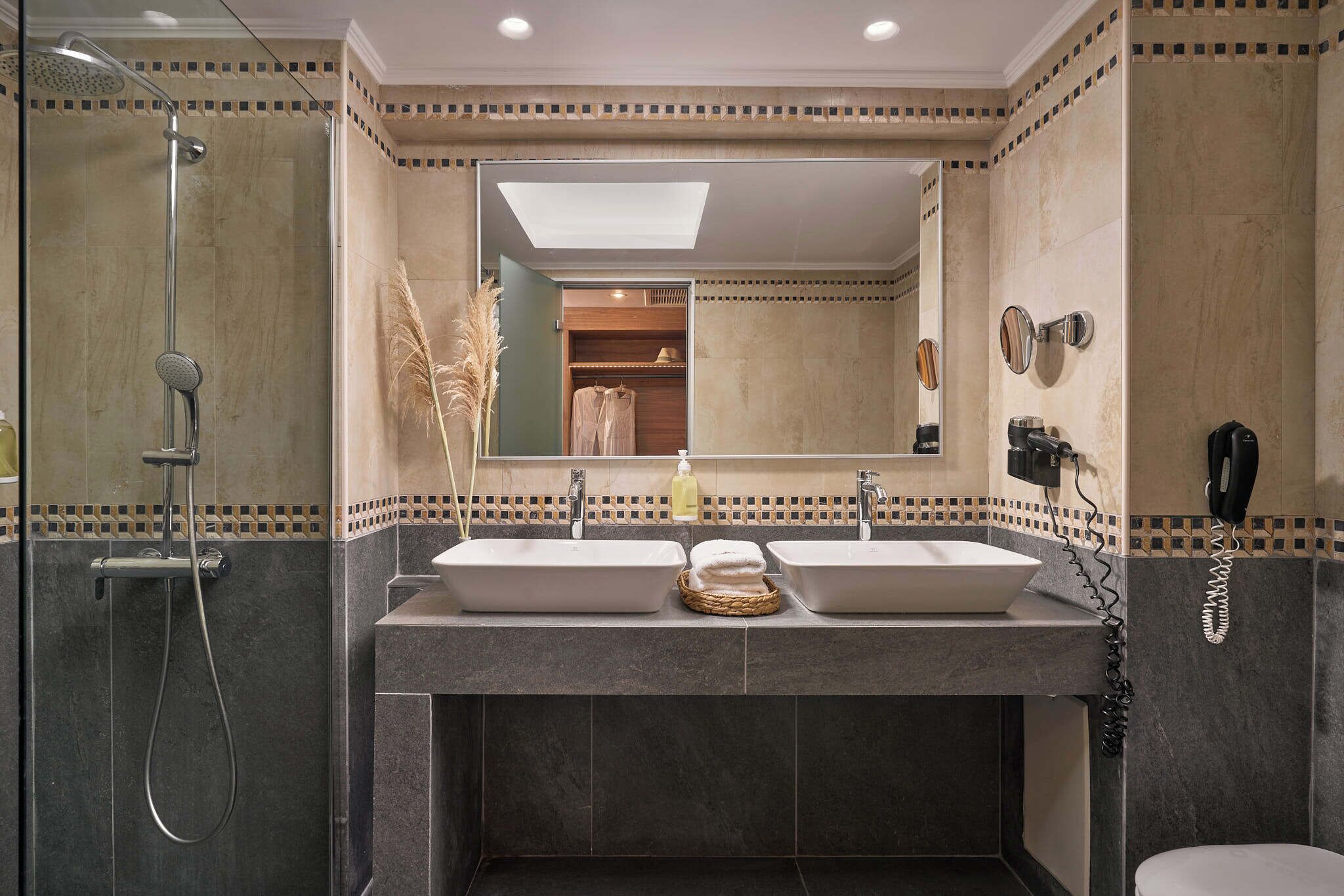 eco-friendly toiletries, hair dryer, slippers, towels