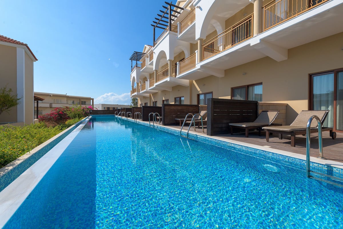 Superior Double Room, Pool Access, Garden View | Minibar, in-room safe, individually decorated, individually furnished