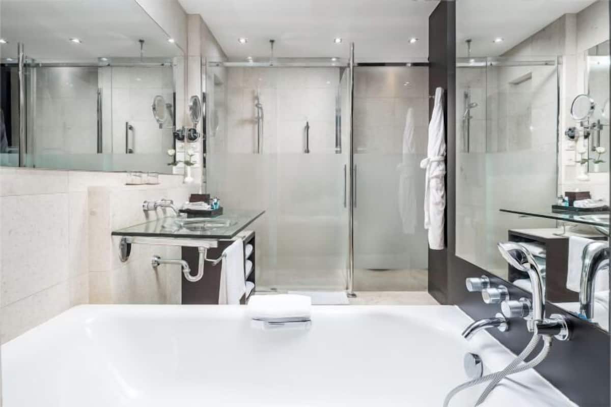 Separate bathtub and shower, rainfall showerhead, designer toiletries