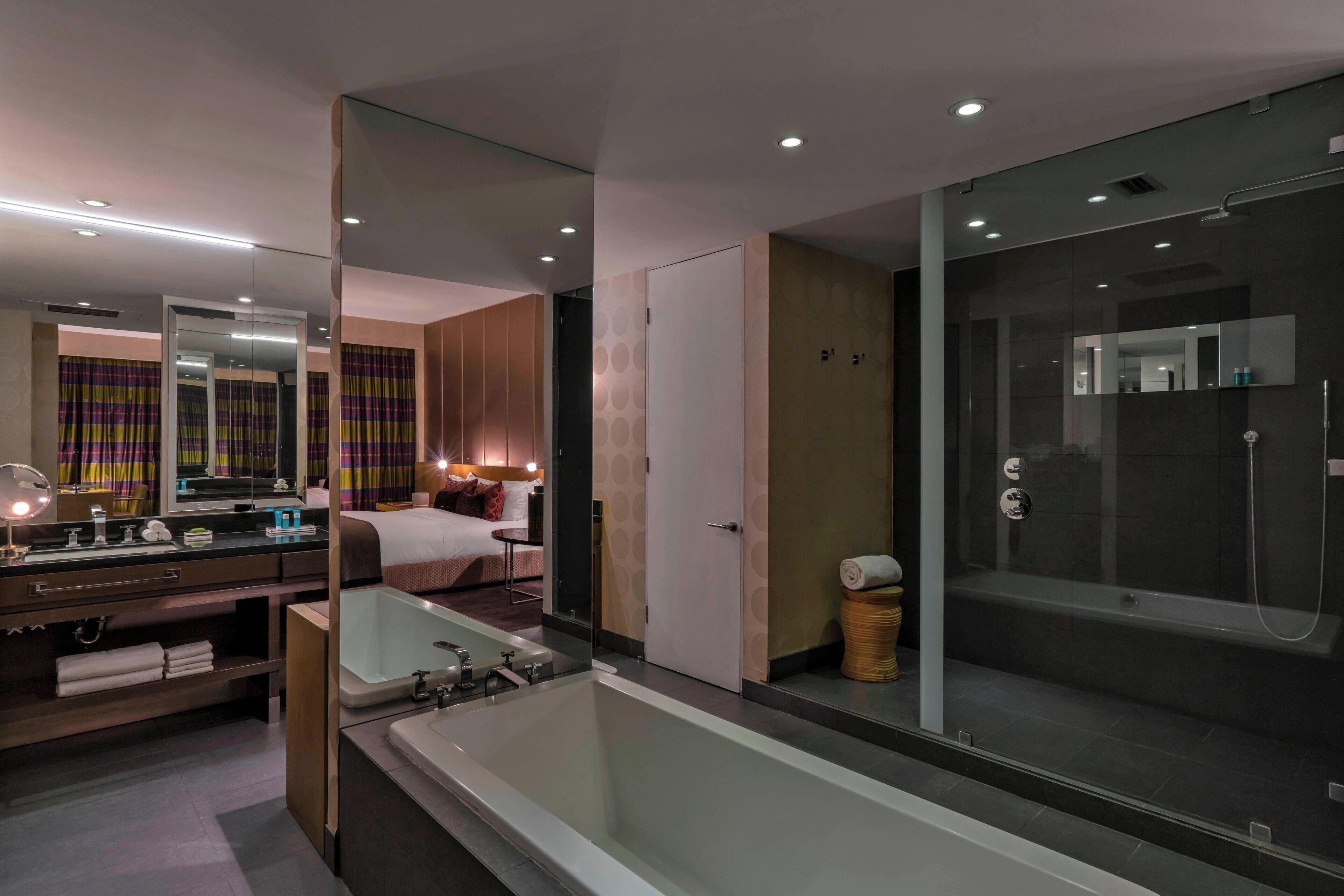 fantastic suite, suite, 1 king bed | bathroom | free toiletries, hair dryer, bathrobes, slippers