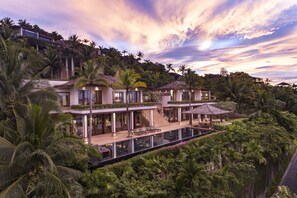 A luxurious resort with a large infinity pool, multiple guest rooms, and lush tropical surroundings. - Andara Resort Villas (Kamala)