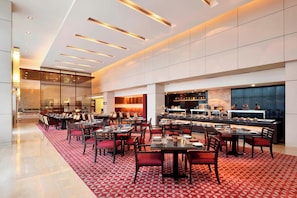 3 restaurants; breakfast, lunch and dinner served  - Courtyard by Marriott Pune Hinjewadi (Paud)