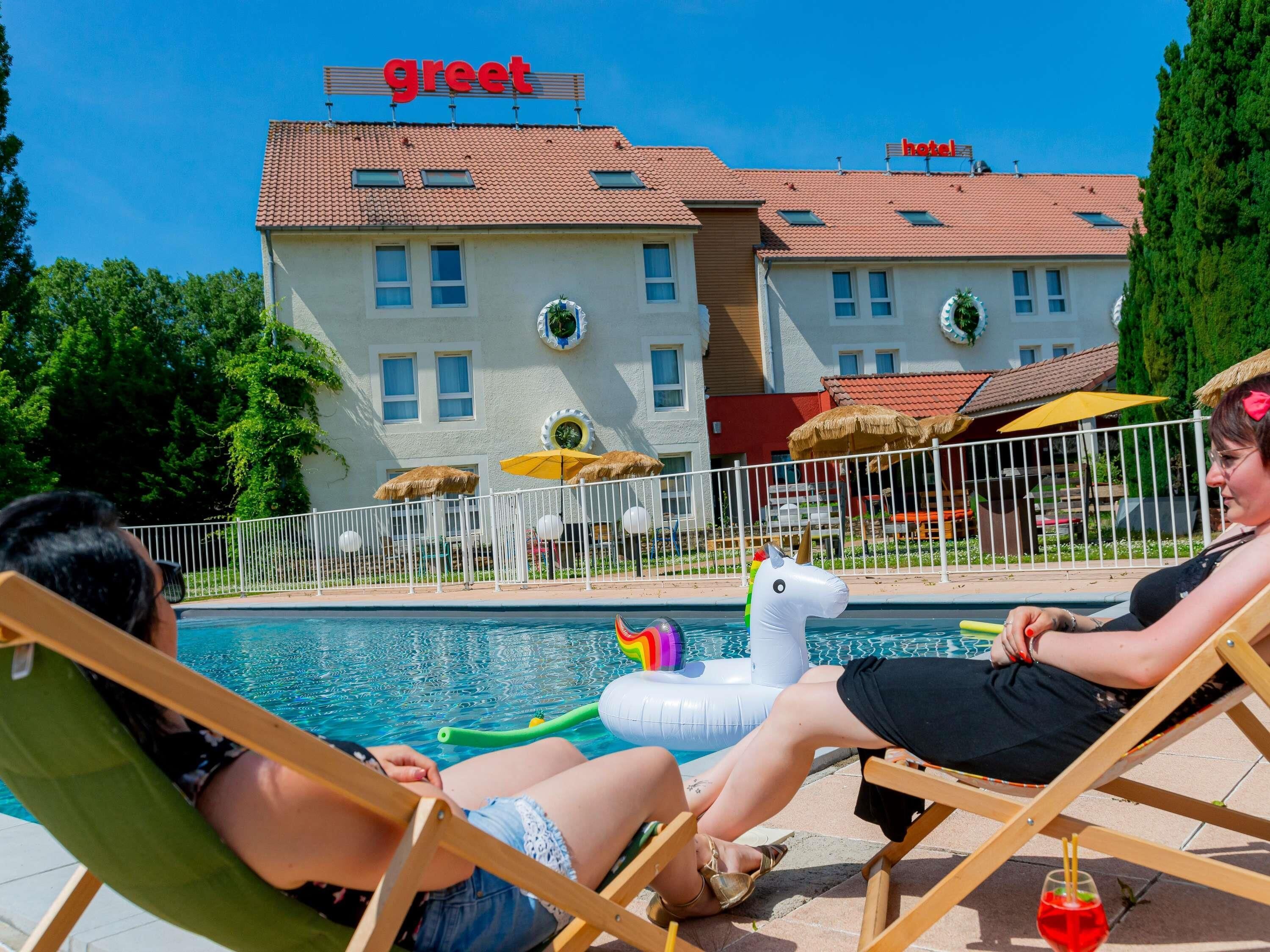 Seasonal outdoor pool, open 9:30 AM to 9:30 PM, pool umbrellas