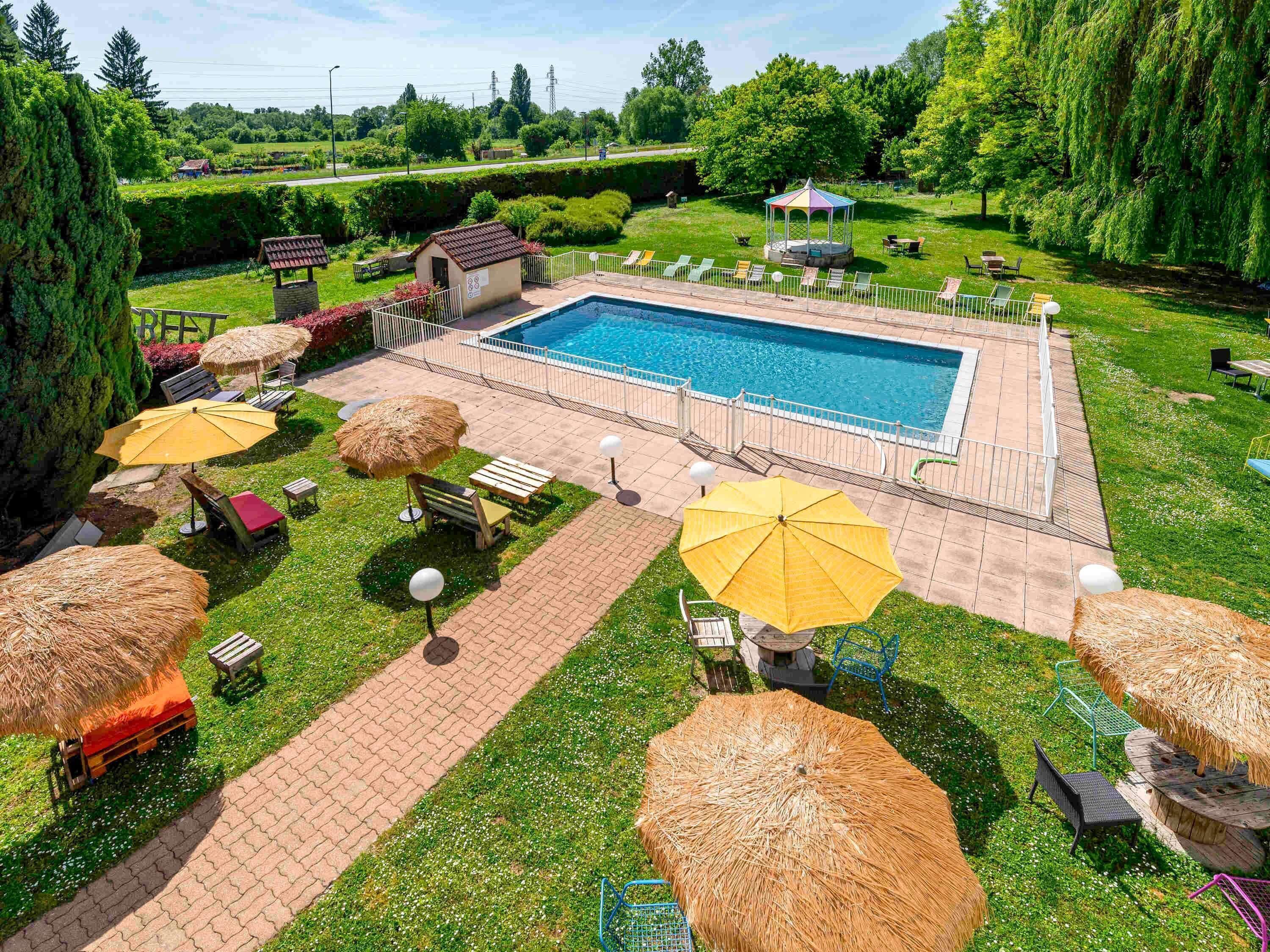 Seasonal outdoor pool, open 9:30 AM to 9:30 PM, pool umbrellas