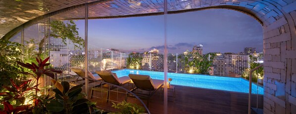 Outdoor pool, open 6:30 AM to 6:00 PM, pool loungers