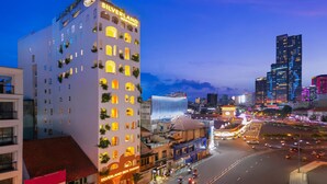 A hotel with multiple balconies and a prominent sign. - Silverland Ben Thanh (Ho Chi Minh City)