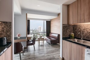 Executive Suite, 1 Bedroom, City View | Living area | 45-inch LCD TV with satellite channels, Smart TV, DVD player - Adelphi Grande Sukhumvit (Bangkok)
