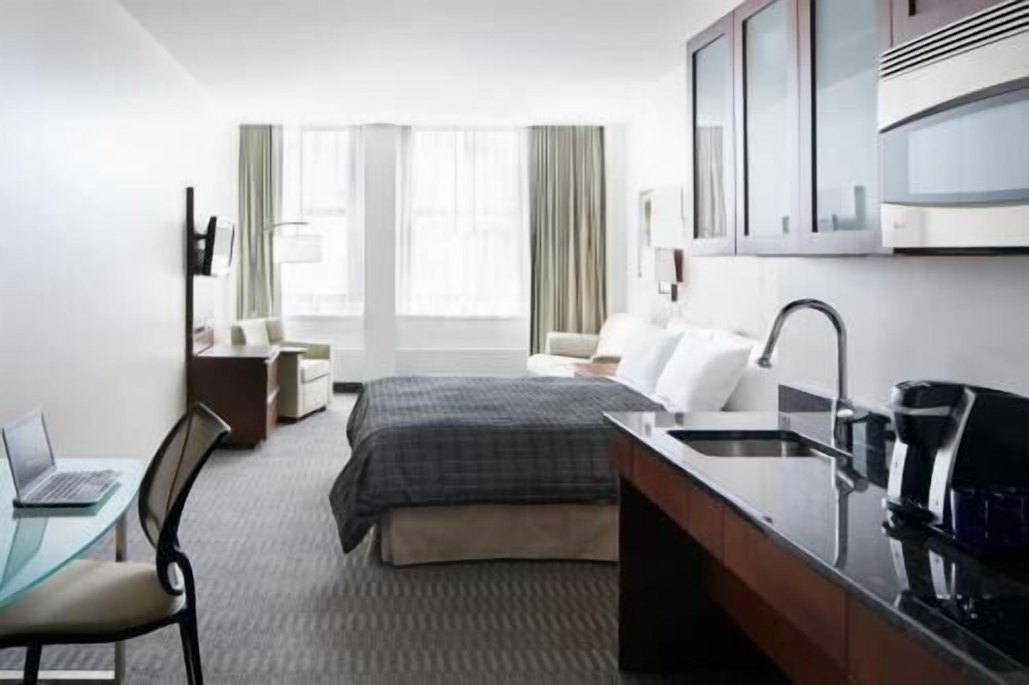 Premium bedding, desk, laptop workspace, free WiFi