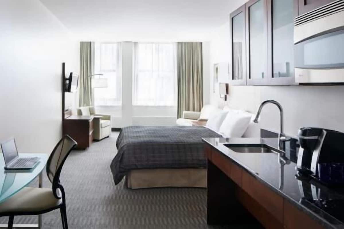 Premium bedding, desk, laptop workspace, free WiFi