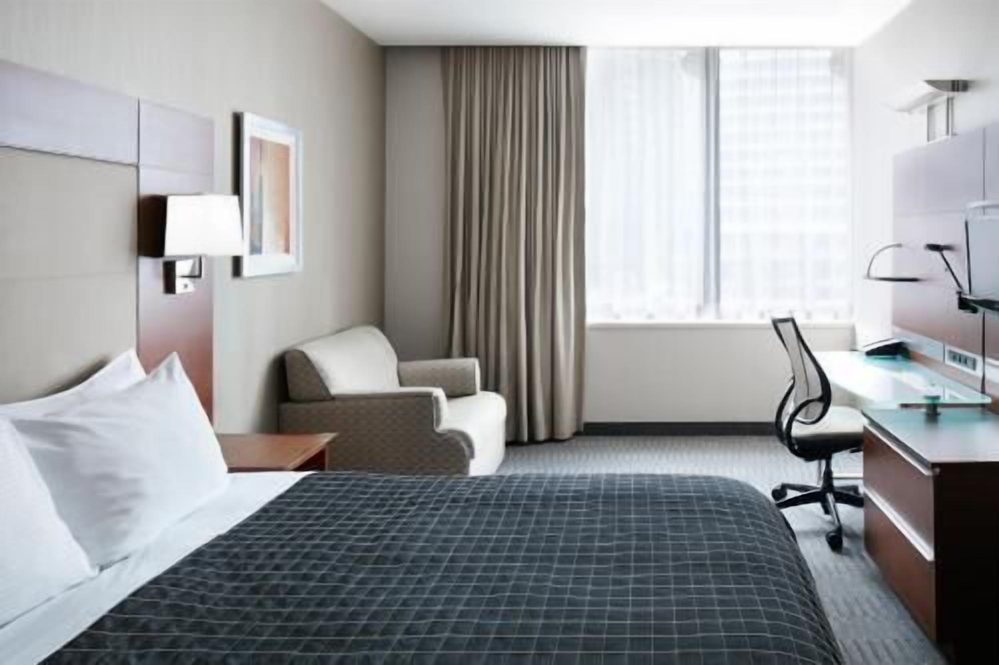 Premium bedding, desk, laptop workspace, free WiFi