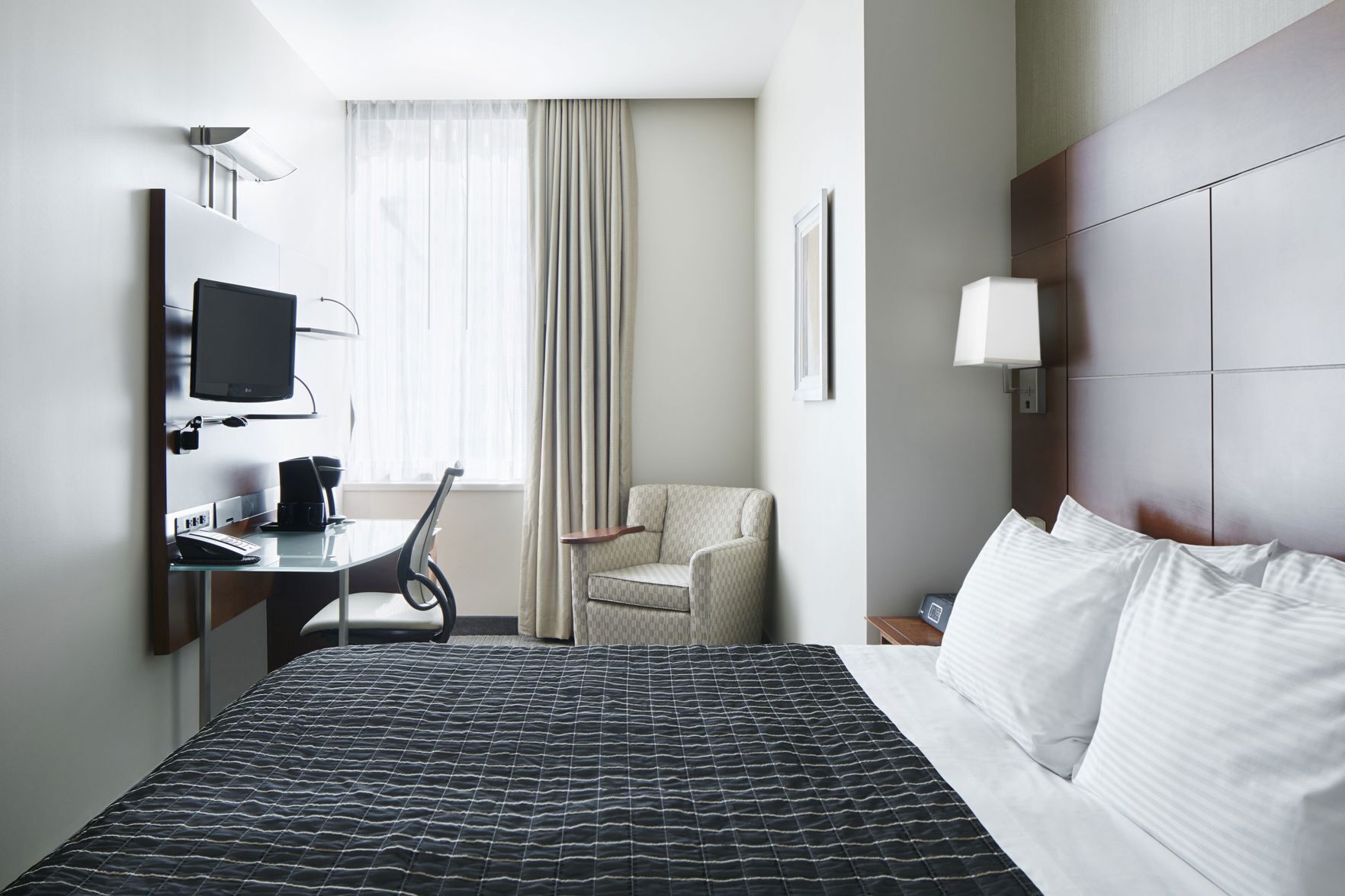 Premium bedding, desk, laptop workspace, free WiFi