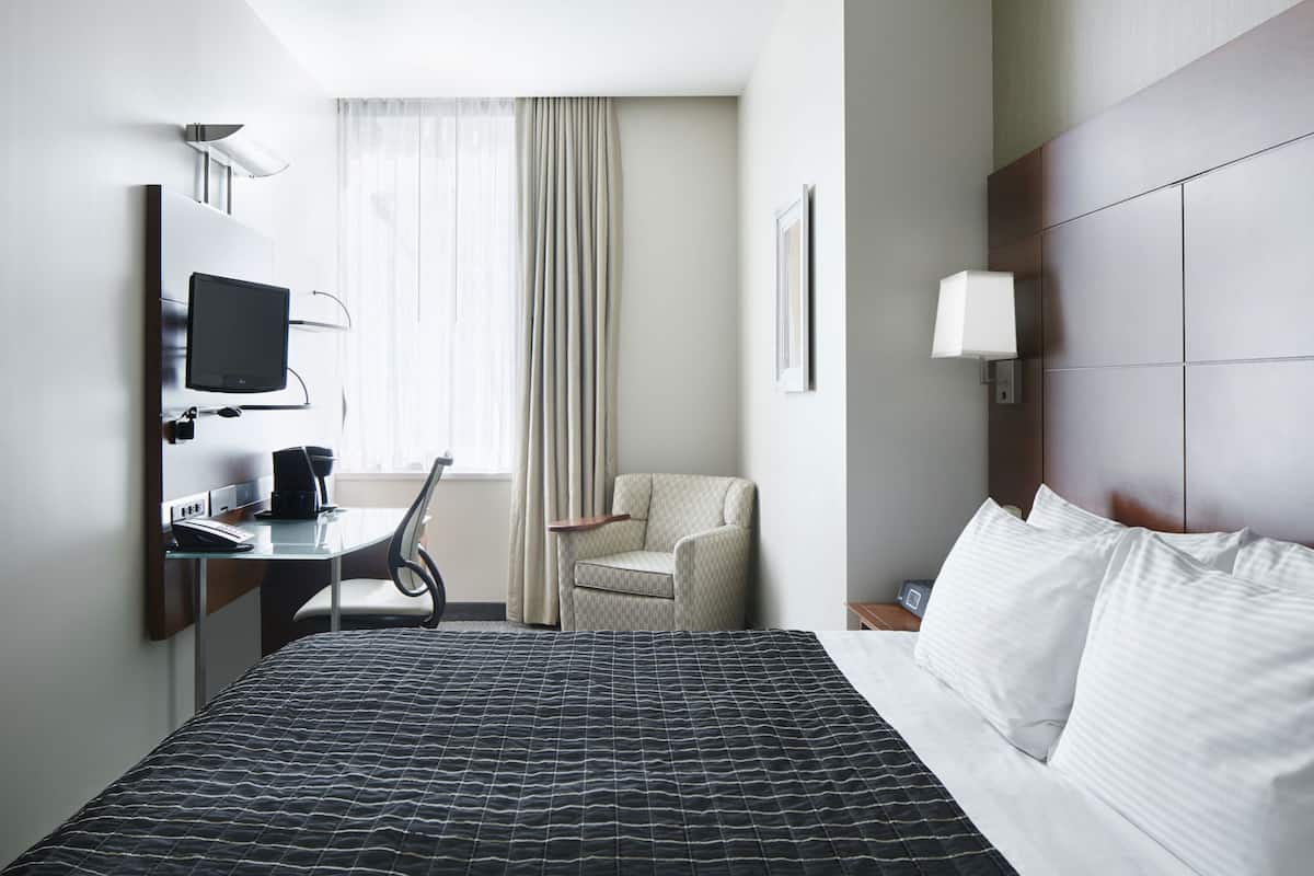 Premium bedding, desk, laptop workspace, free WiFi