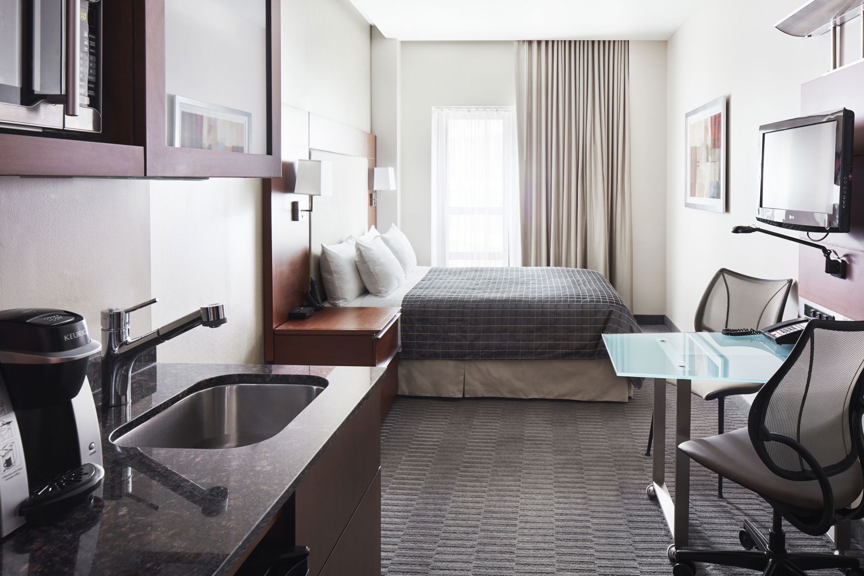 Premium bedding, desk, laptop workspace, free WiFi