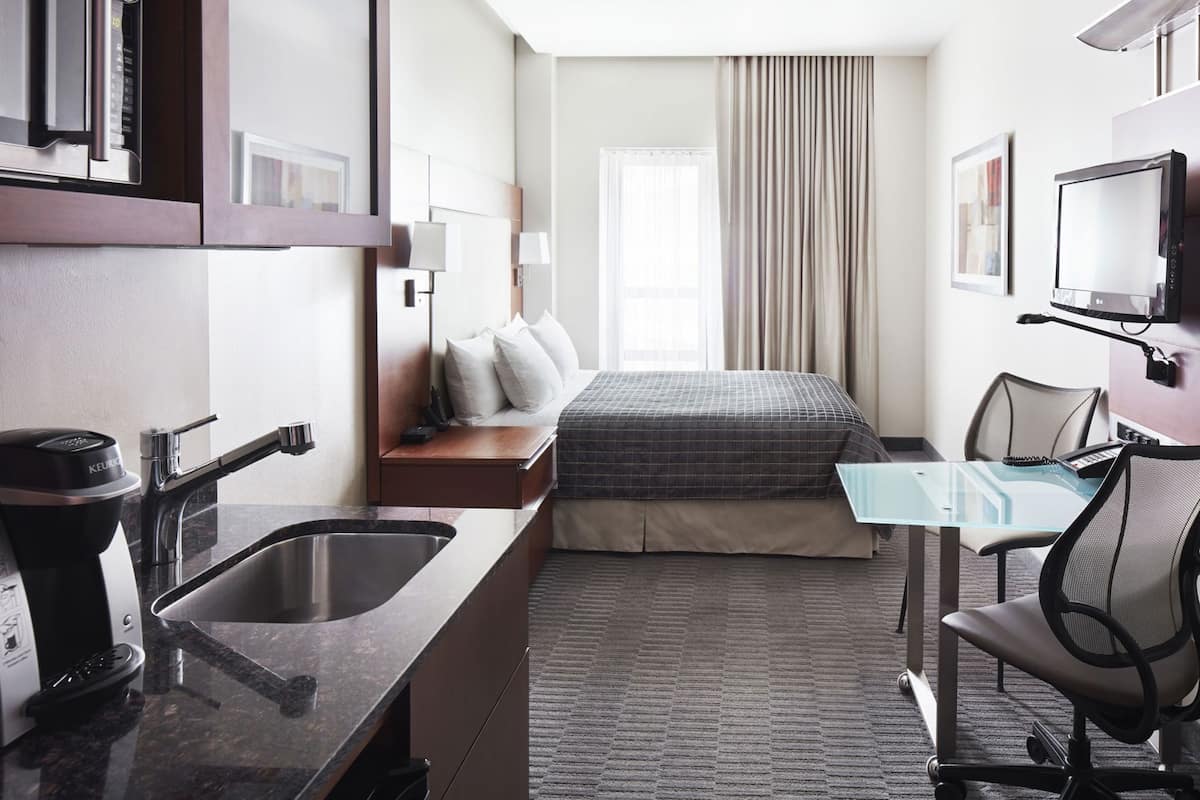 Premium bedding, desk, laptop workspace, free WiFi
