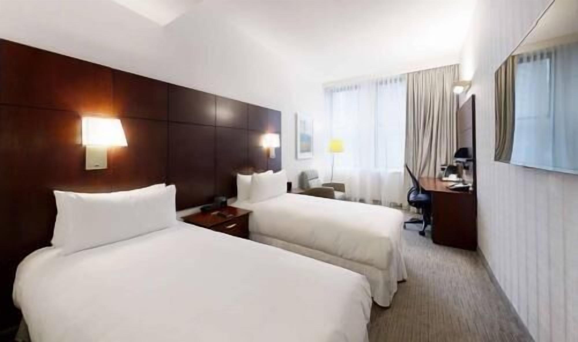 Premium bedding, desk, laptop workspace, free WiFi