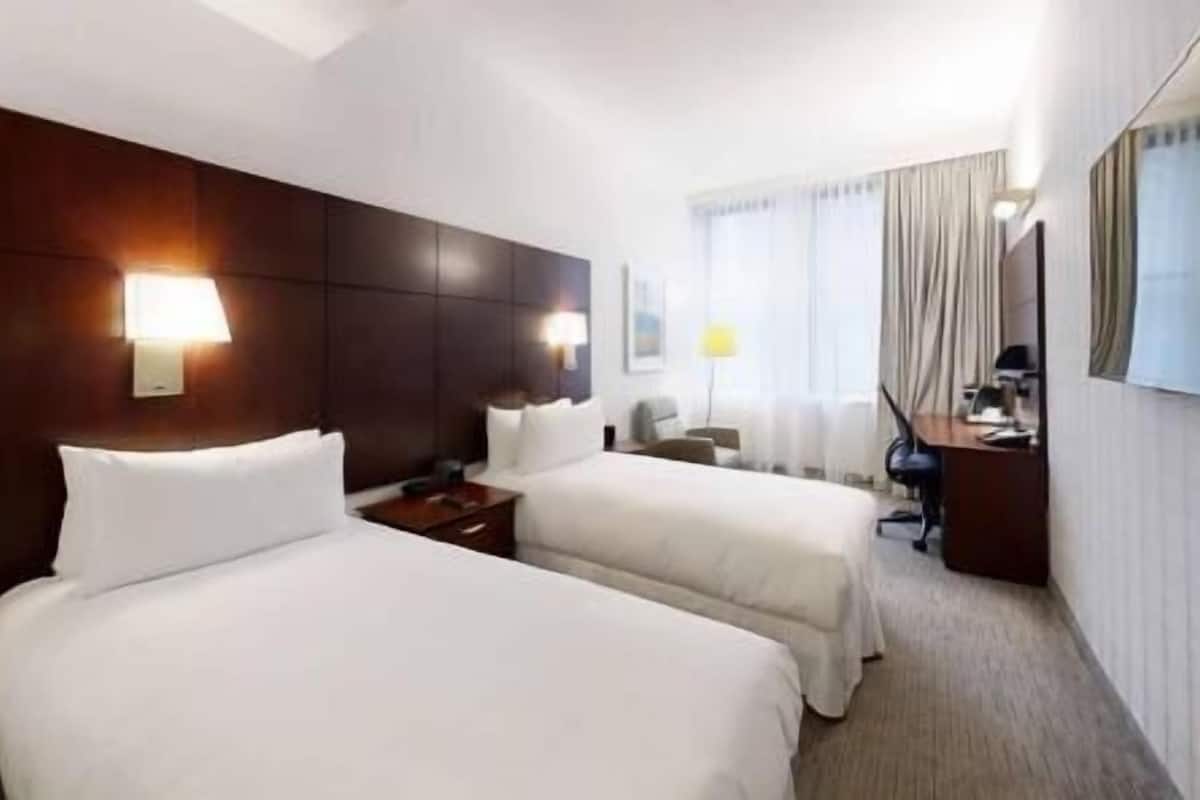 Premium bedding, desk, laptop workspace, free WiFi