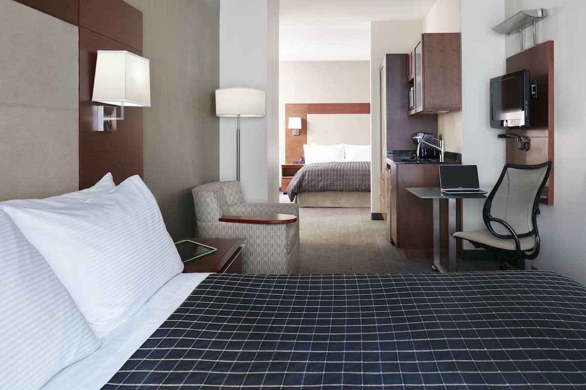 Premium bedding, desk, laptop workspace, free WiFi