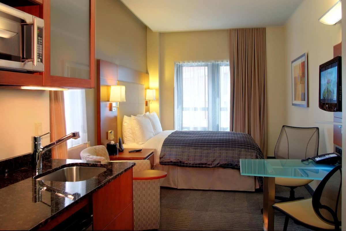 Premium bedding, desk, laptop workspace, free WiFi