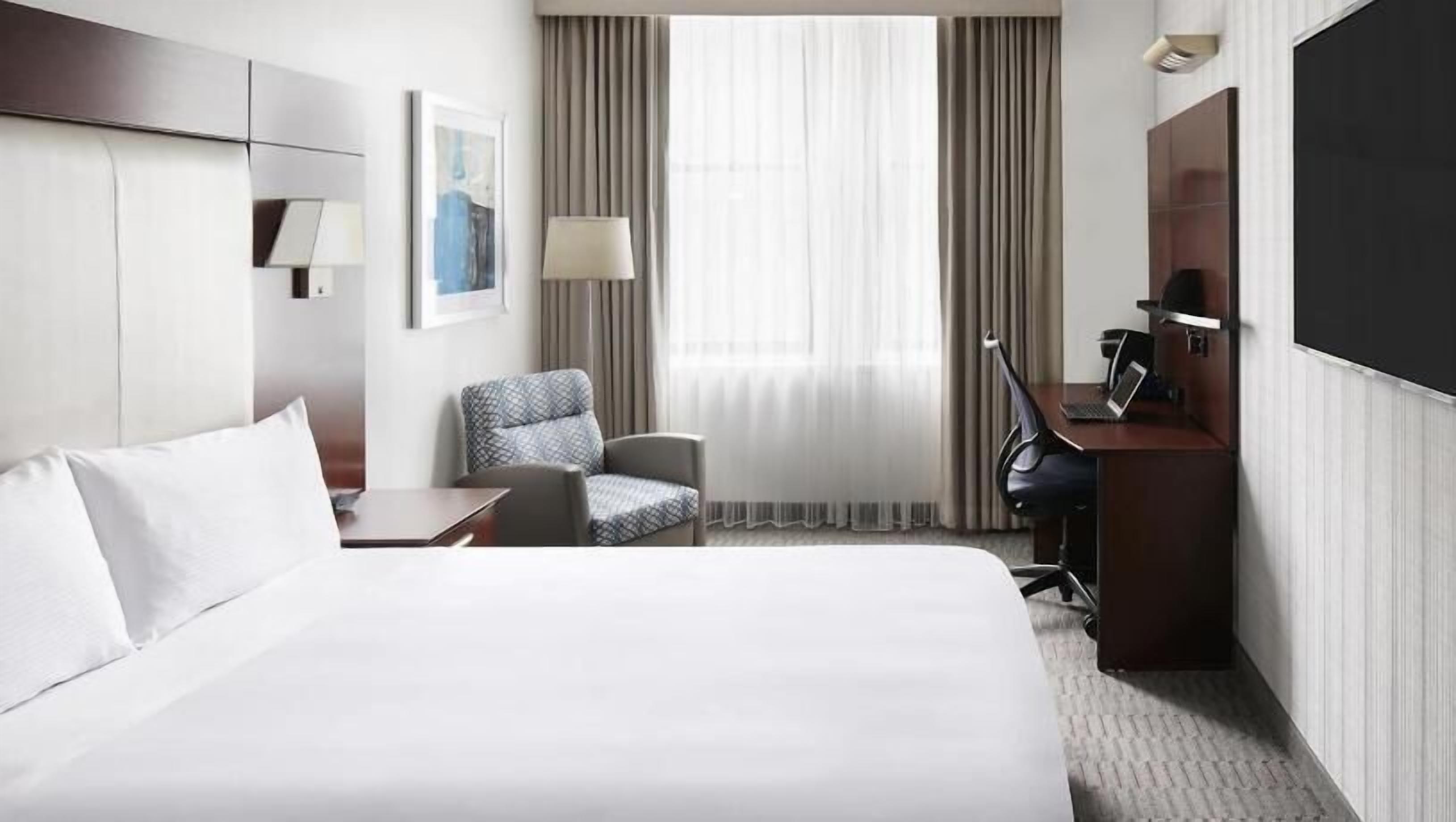 Premium bedding, desk, laptop workspace, free WiFi