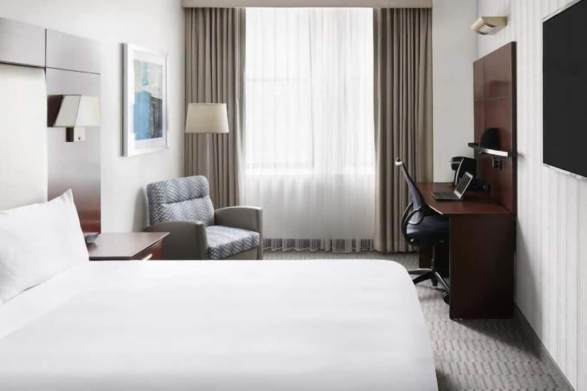 Premium bedding, desk, laptop workspace, free WiFi