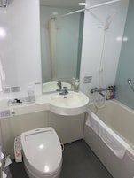 Combined shower/tub, free toiletries, hair dryer, slippers