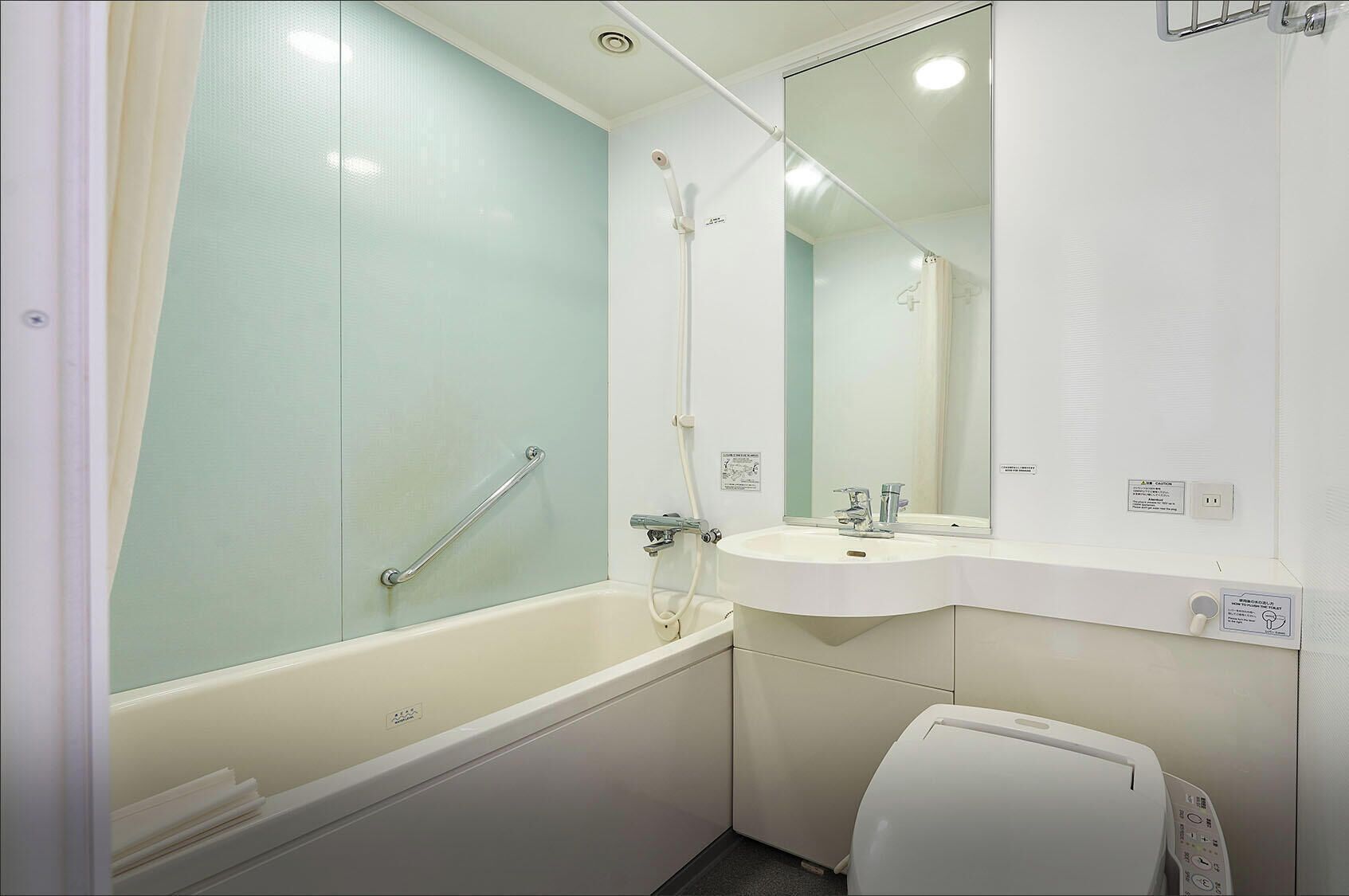 Combined shower/tub, free toiletries, hair dryer, slippers
