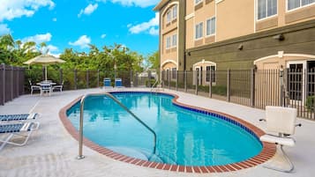 Outdoor pool, pool umbrellas, sun loungers