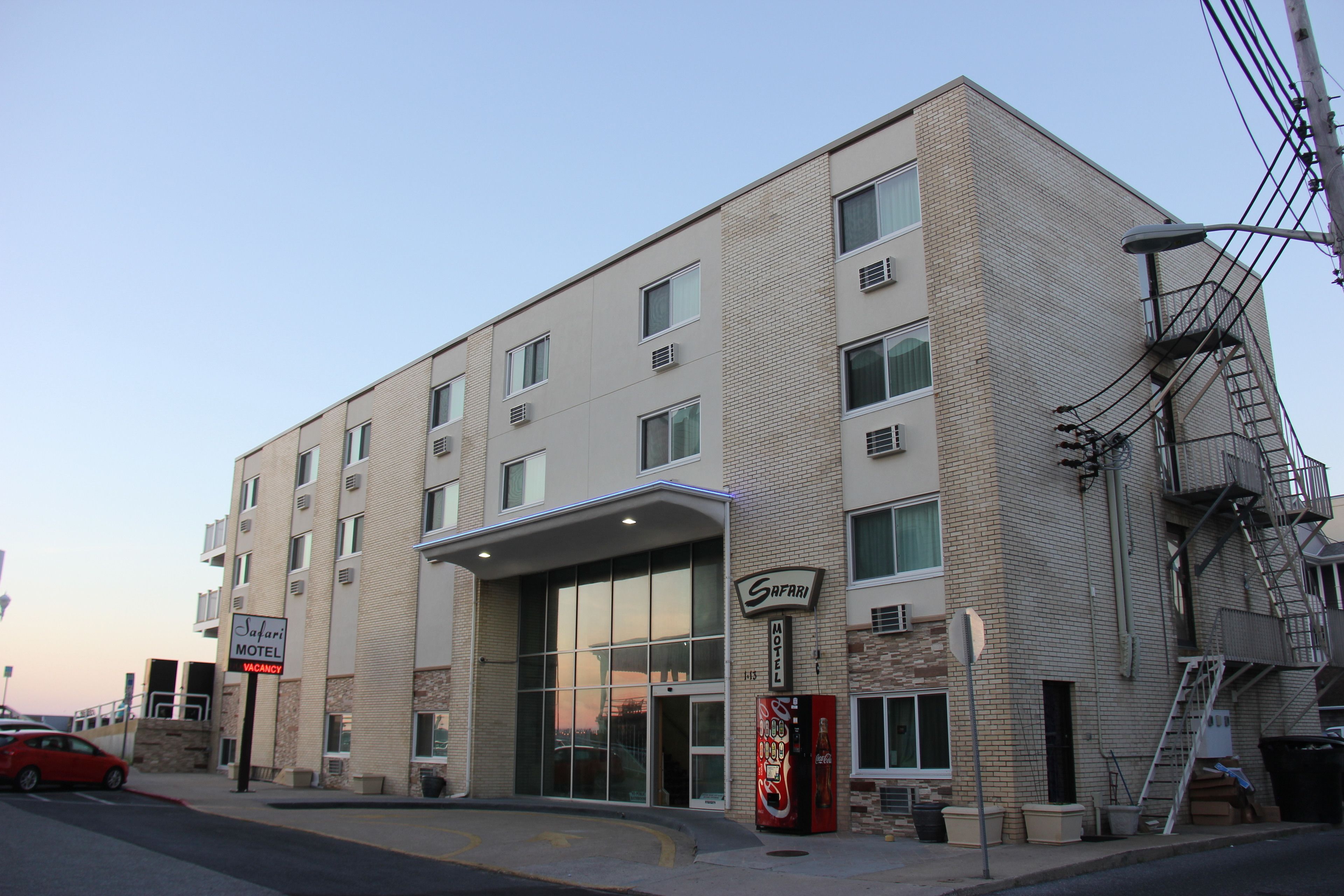 A two-story building with a sign reading "Safari Motel."