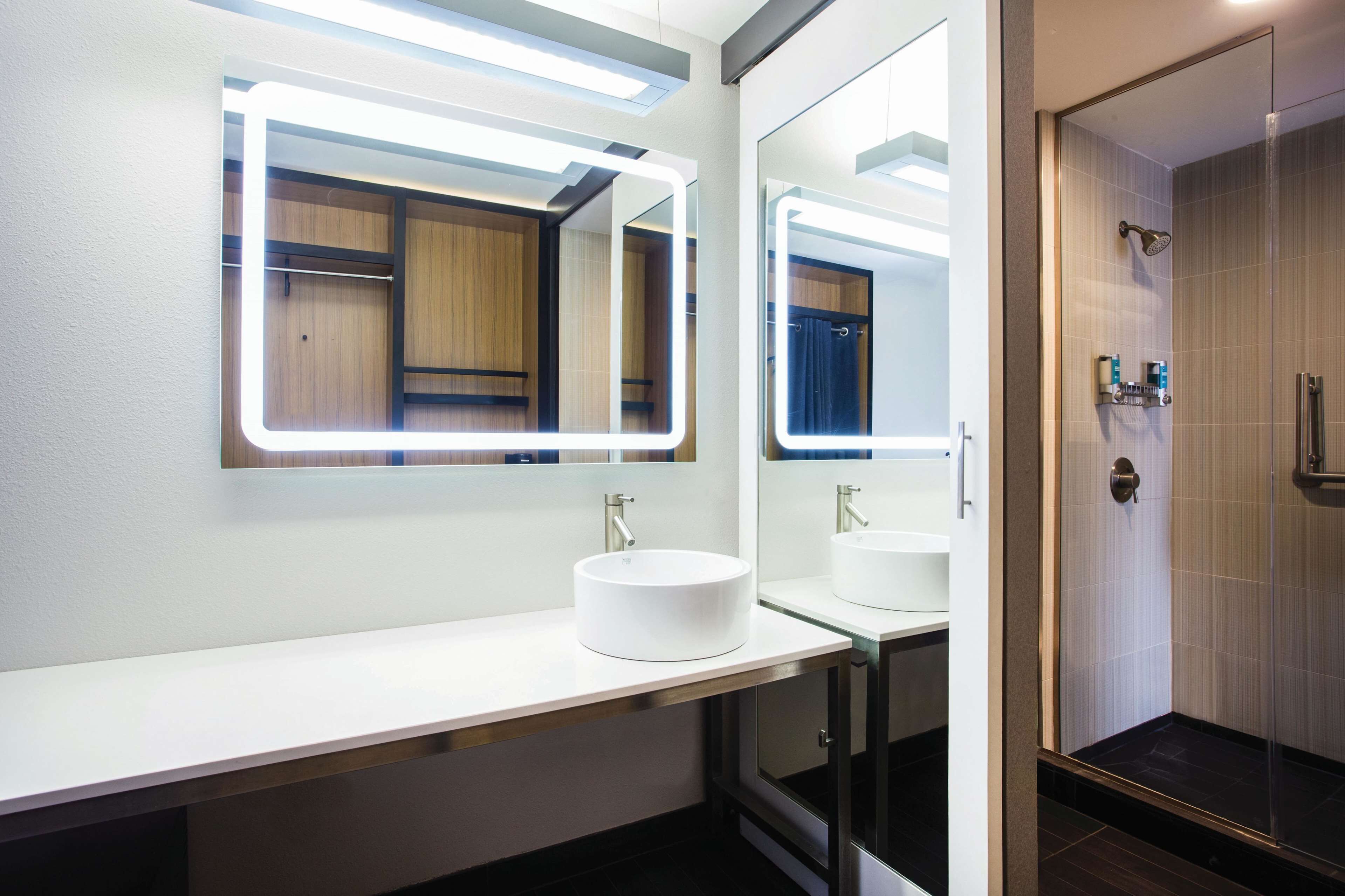 shower, designer toiletries, hair dryer, towels