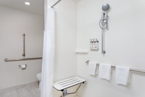 Combined shower/bathtub, designer toiletries, hair dryer, towels