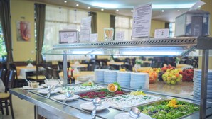 A buffet area with various food options, including salads, fruits, and a coffee machine. - Hotel Royal (Golden Sands)