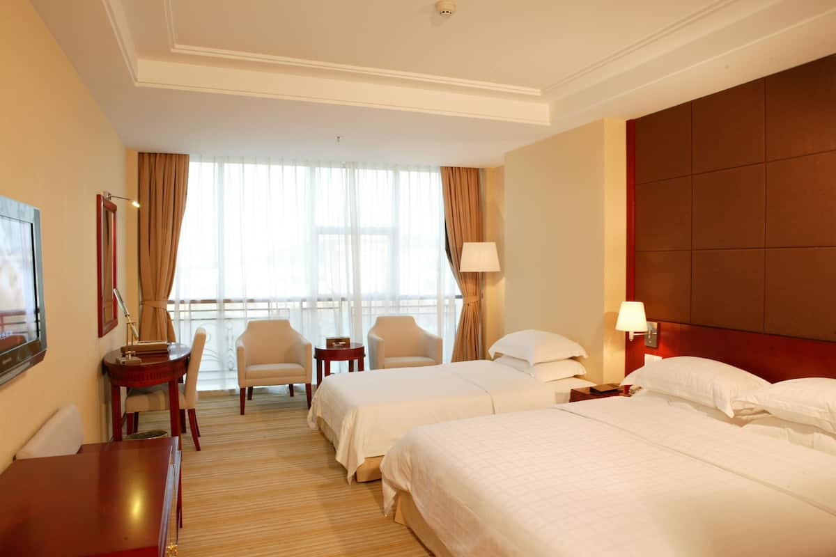 Premium bedding, memory-foam beds, minibar, in-room safe