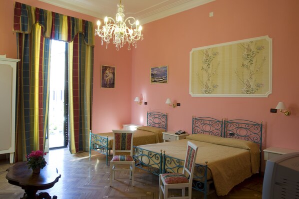 Superior Triple Room | Minibar, in-room safe, desk, blackout curtains