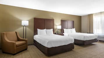 Premium bedding, desk, laptop workspace, blackout curtains