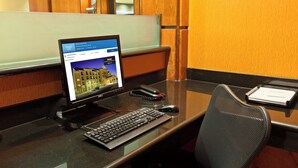 A hotel reception desk with a computer, keyboard, mouse, and a telephone. - Fairfield Inn & Suites by Marriott El Paso (El Paso)
