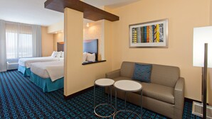 A hotel room with two beds, a sofa, two small tables, and a framed artwork on the wall. - Fairfield Inn & Suites by Marriott El Paso (El Paso)