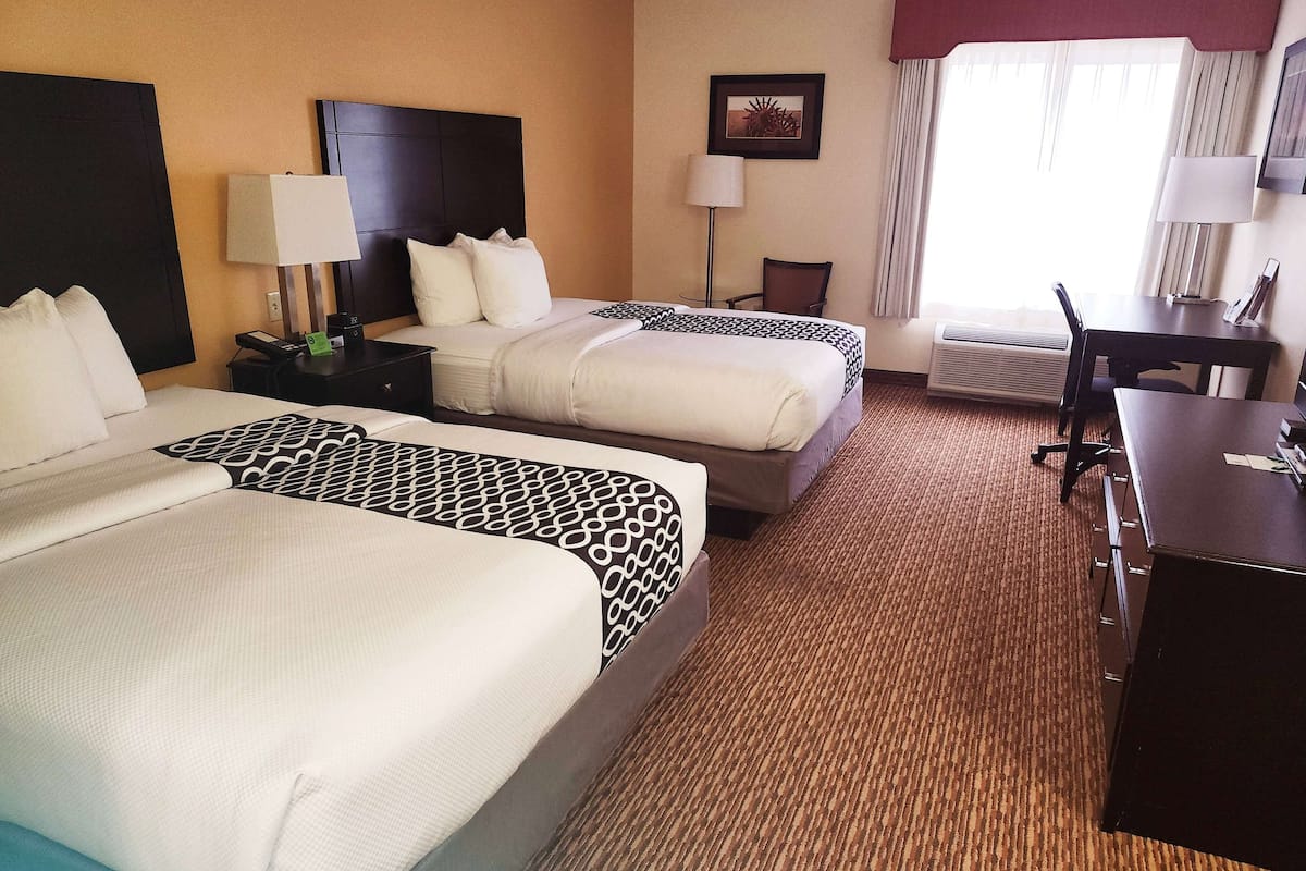 Premium bedding, pillow-top beds, desk, blackout curtains