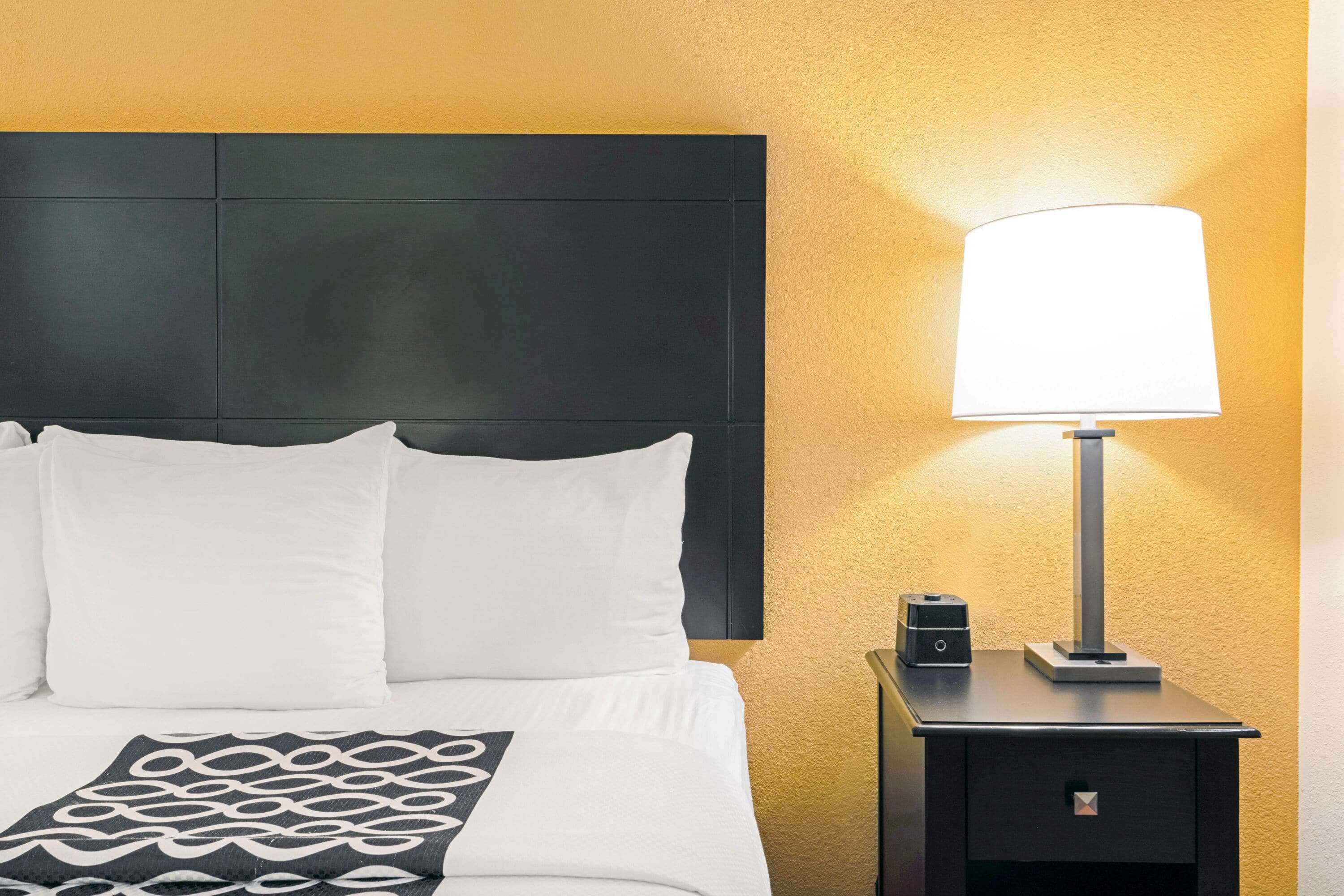 premium bedding, pillow-top beds, desk, blackout curtains