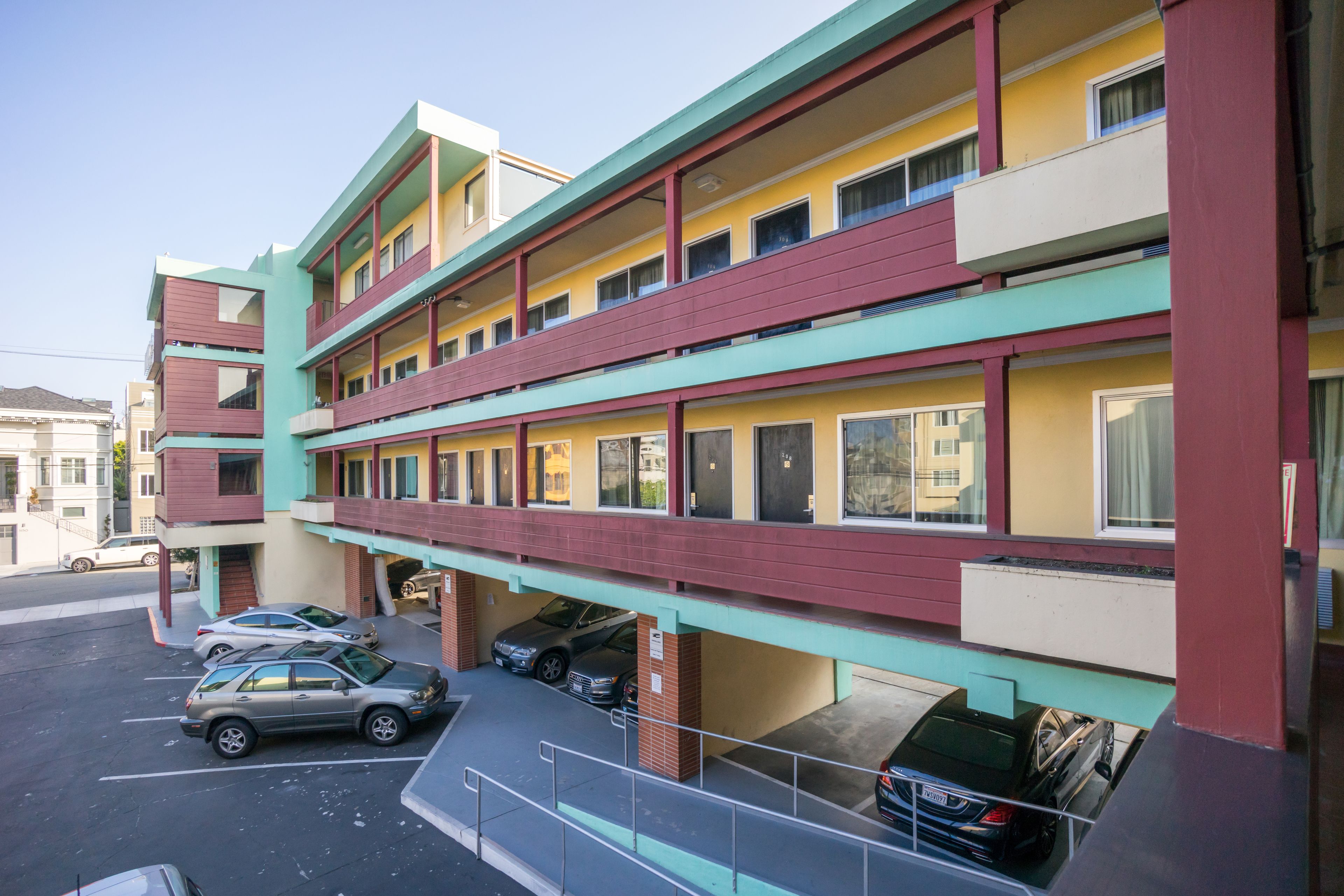 A multi-story building with a parking garage.