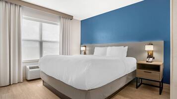 Suite, 1 Bedroom, Non Smoking | Desk, laptop workspace, blackout drapes, iron/ironing board