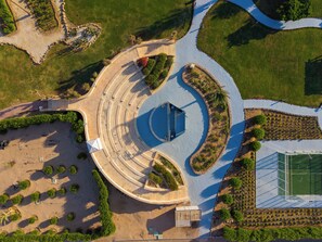 An aerial view of a landscaped area with a central circular structure, surrounded by pathways and greenery. - Aurora Oriental Resort Sharm El Sheikh (Sharm El Sheikh)