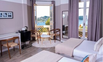 Habitación cuádruple superior, vistas al mar | Wifi gratis y ropa de cama