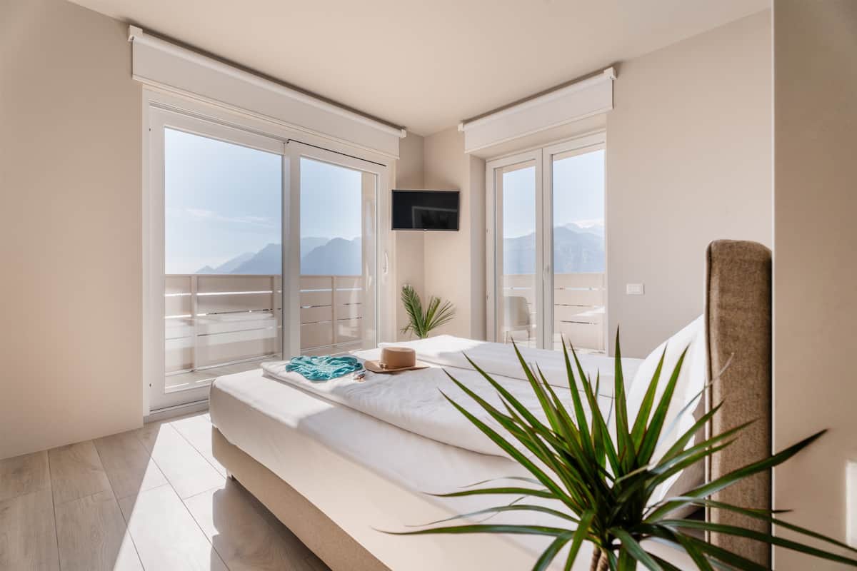 Deluxe Room, Balcony, Lake View | In-room safe, desk, iron/ironing board, free WiFi