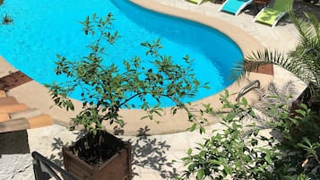 Seasonal outdoor pool, open 8:30 AM to 8:30 PM, pool loungers