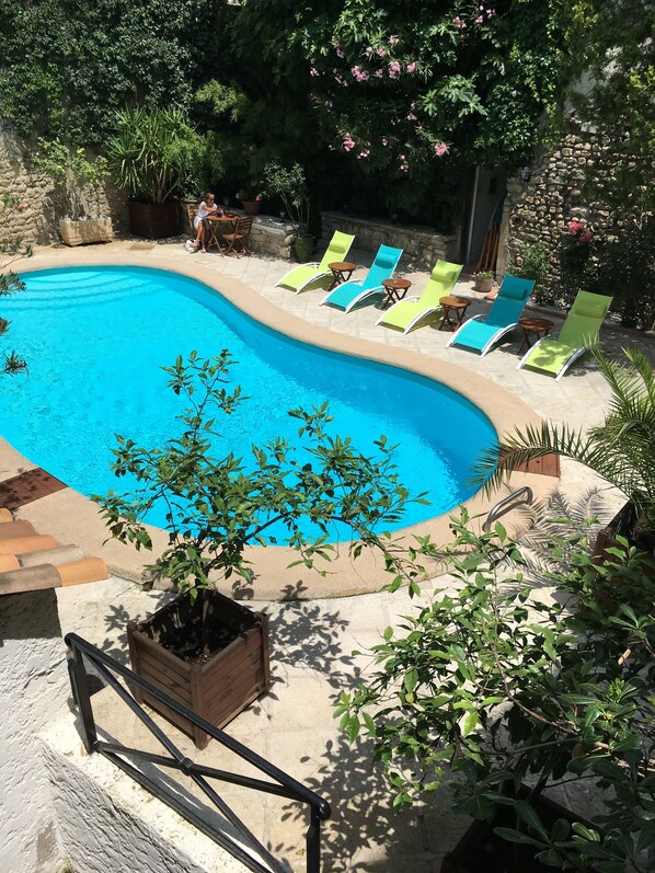 Seasonal outdoor pool, open 8:30 AM to 8:30 PM, pool loungers