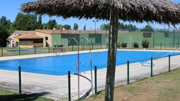 Seasonal outdoor pool, open noon to 8:00 PM, pool umbrellas
